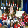 Julianne and Rachel Moss – flanked by His Excellency the Right Honourable David Johnston, Governor General of Canada, and His Honour Frank Fagan, Lieutenant Governor of Newfoundland and Labrador – prepare to receive their Governor General’s Caring Canadian Awards during a ceremony at Beachy Cove Elementary.